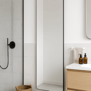 Modern bathroom with wooden cabinets, wall mirror, and minimalist decor