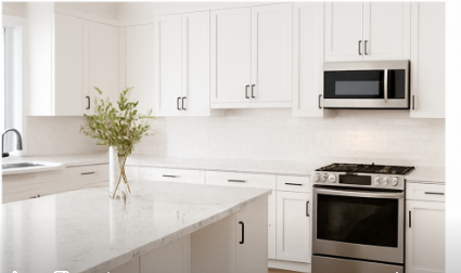 Bright modern Vancouver kitchen with high-quality white shaker-style cabinets, marble countertops, and soft natural lighting — designed and installed by Blue Valley Cabinets