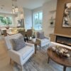 Coordinated custom millwork connecting a modern kitchen, dining area and fireplace feature wall